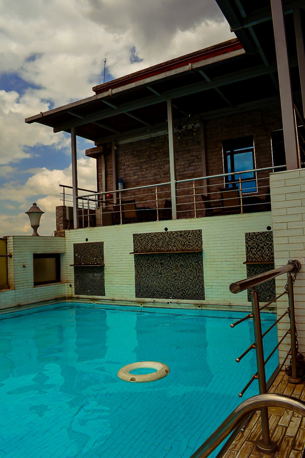 A quiet poolside moment at Taidy's Suites Nakuru